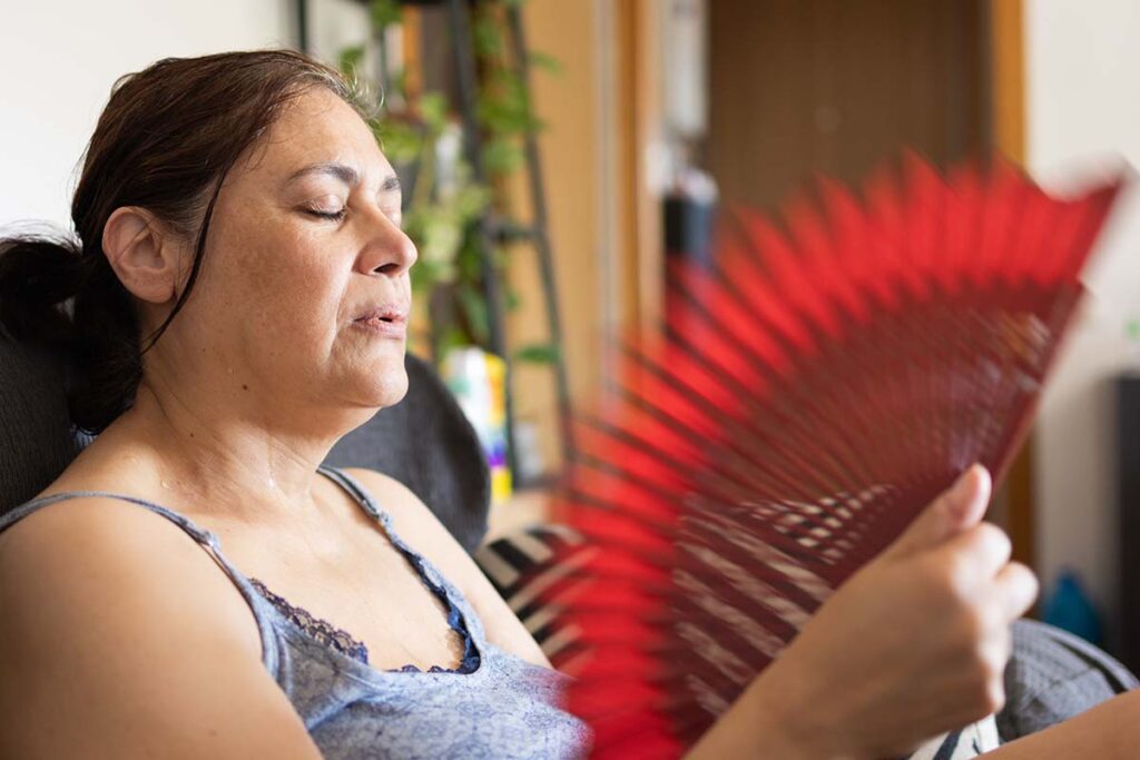 woman fanning herself