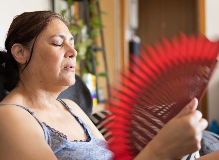 woman fanning herself