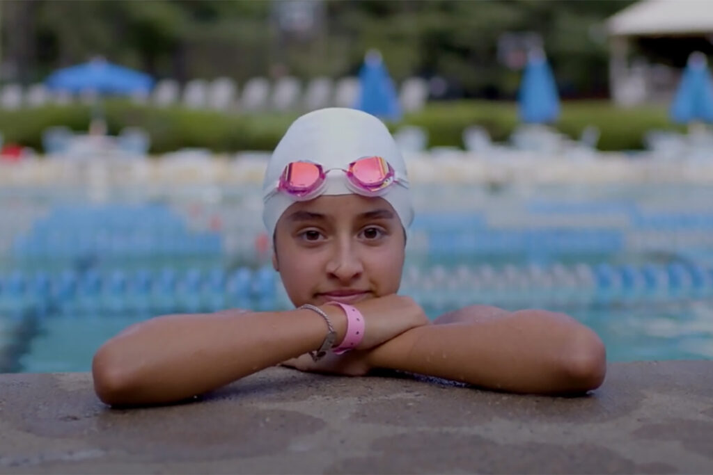 Girl with swim cap and goggles