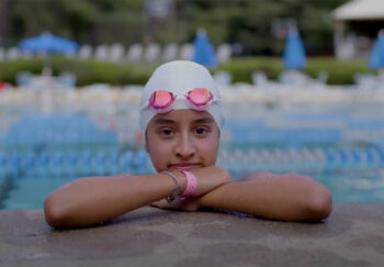 Girl with swim cap and goggles