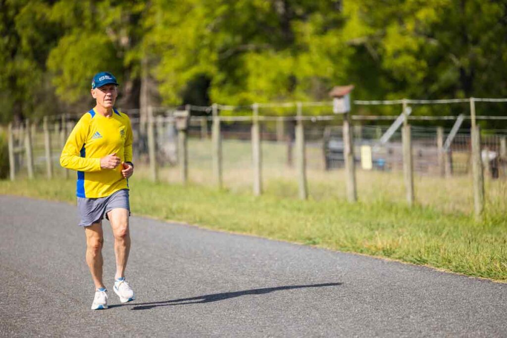 Harry Landers running on a road in the Virginia countryside