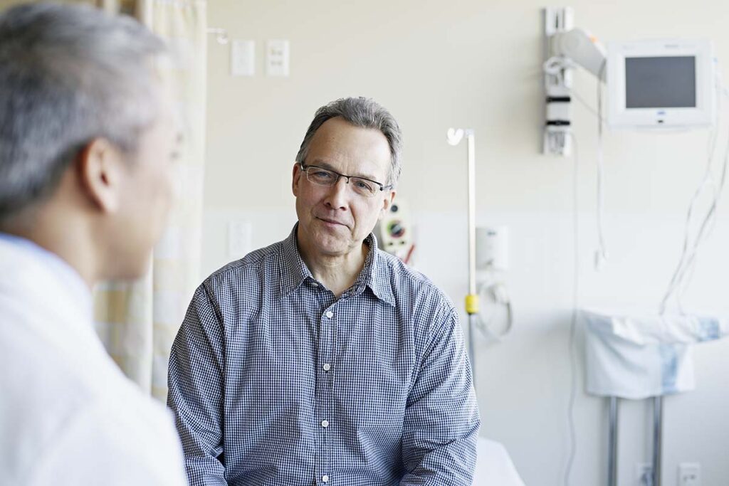 a doctor talks with a patient