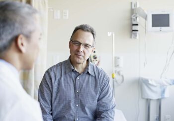 a doctor talks with a patient