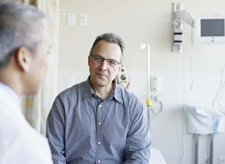 a doctor talks with a patient