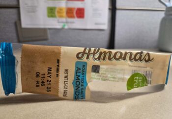 an empty wrapper of a pack of almonds