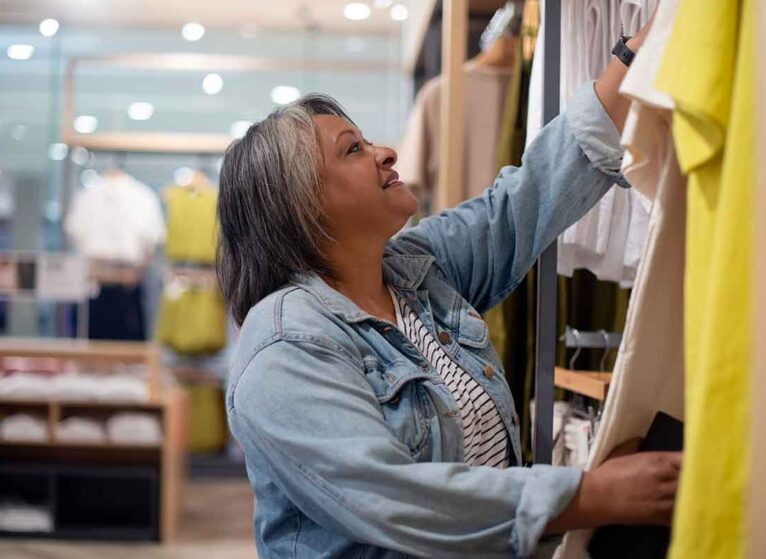 A woman shopping for ostomy clothing
